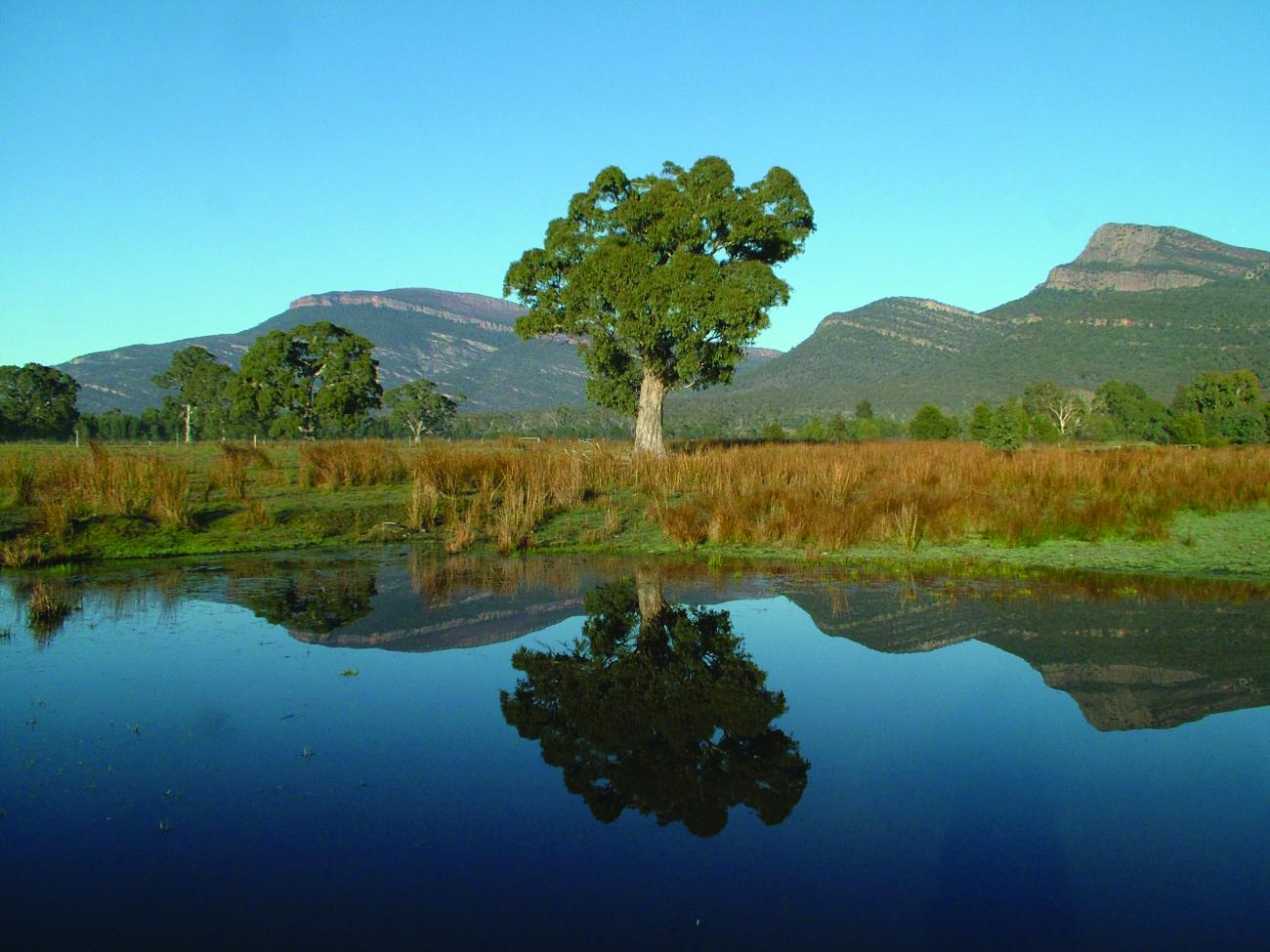 Long shot of Pomonal landscape with lake in foreground