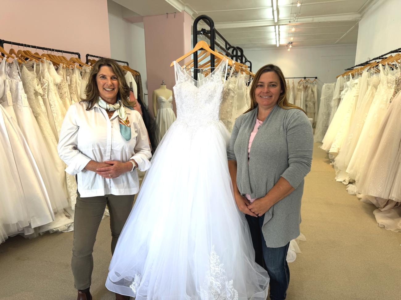 Two women standing in a bridal shop