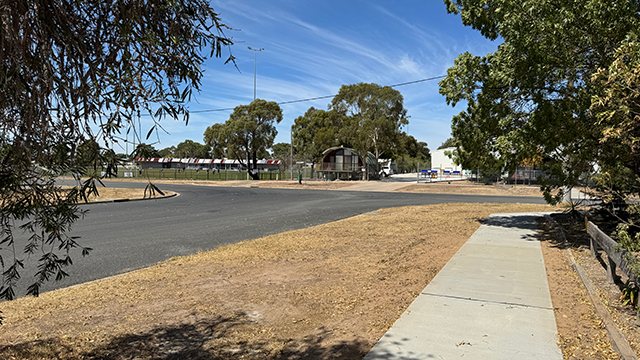 A residential street on a sunny day with blue sky